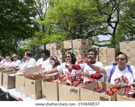 New York, NY, USA - May 18, 2014: Volunteers give away jsnack to the people participating to the AIDS Walk New York 2014 on Riverside Drive, Manhattan