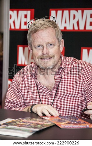 New York, NY, USA - October 11 2014: Marvel artist Marc Bagley signs comic book at Comic Con 2014 at The Jacob K. Javits Convention Center in New York City