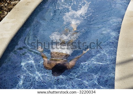 Women swimming in the Lazy River in the blue water