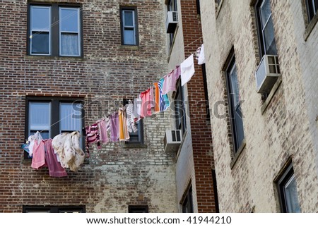 Drying linen and clothes on the rope outside the window