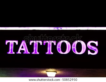 neon tattoo sign. stock photo : Neon sign