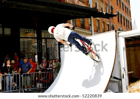 NEW YORK - MAY 01: Dave Voelker BMX Stunt Show perform at the Family Festival Street Fair during the 2010 Tribeca Film Festival on May 1, 2010 in NYC