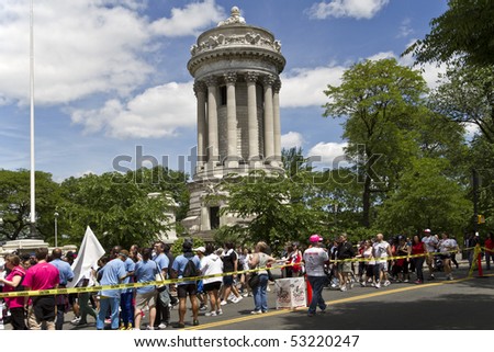 NEW YORK - MAY 16: People participating to the AIDS Walk 2010 walking down Riverside Drive near soldiers memorial on May 16, 2010 in New York City.