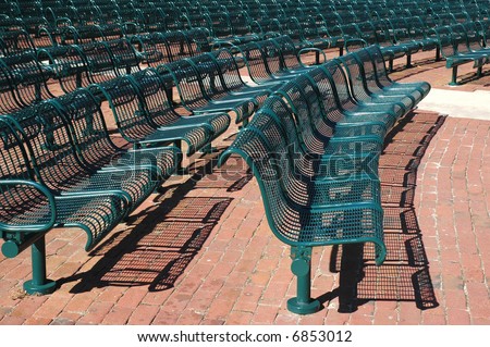 Rows of metal seats in an outdoor activity center