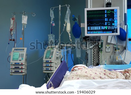 ICU room in a hospital with medical equipments and a patient