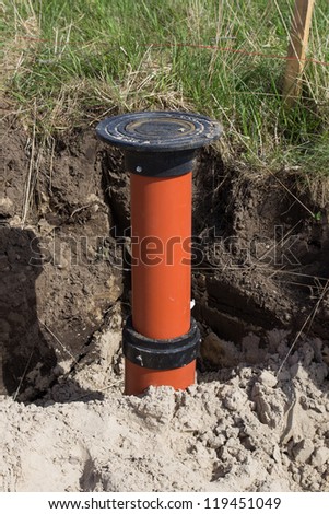 Sewer Pipe. Photography of a road construction site, new waste-water pipes are laid