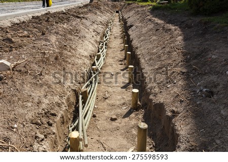 New street construction, waste water trench installed with wood