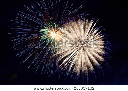 Beautiful fireworks blowing up on dark background
