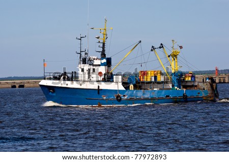 fishing ship in port going to the sea
