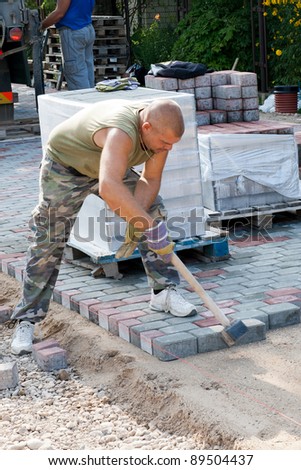 Worker on job. Constructing a new street