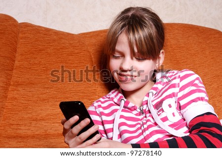 girl play games on her Touchscreen Phone