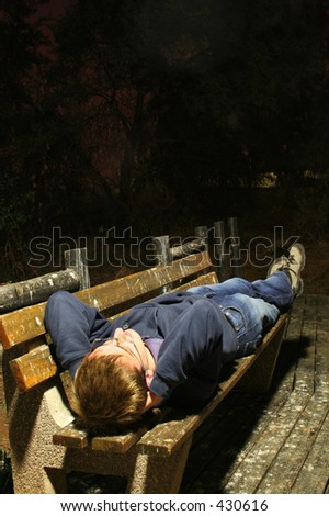 Guy lying on bench