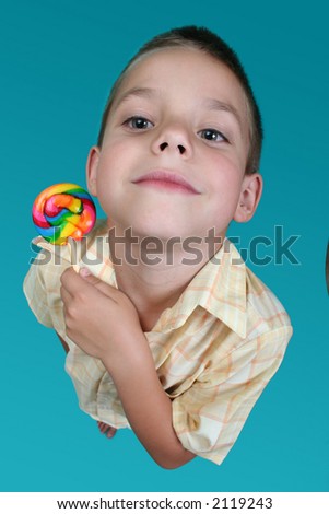 Wide eyed boy with colorful candy