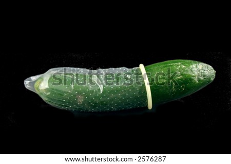 stock-photo-green-cucumber-with-condom-o