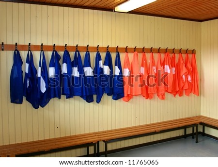 Soccer practice vests hanging in a locker room