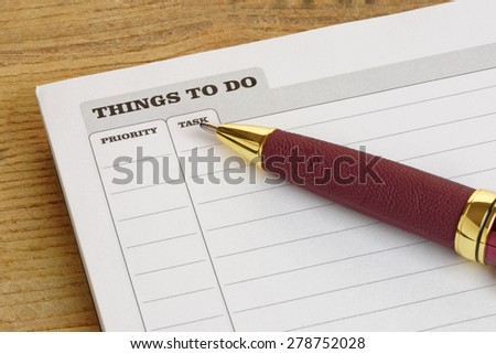Things To Do list with a pen, on a desk.Business concept.