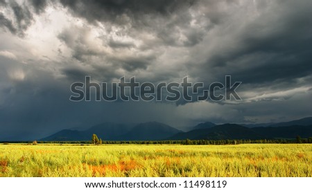 Mountain landscape with storm clouds