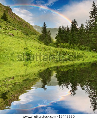 Landscape with forest and rainbow