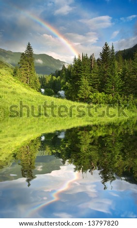 Landscape with forest and rainbow