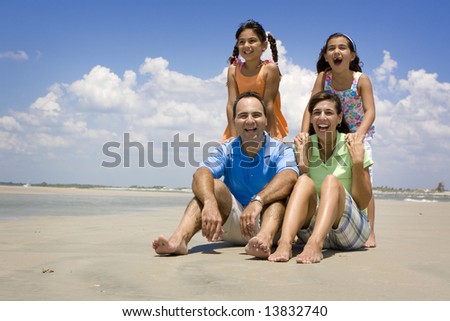 Family on vacation walking on a beach