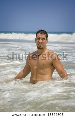 A muscular man in the ocean