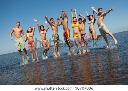 Group of young people having fun at the beach