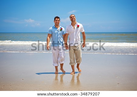 GP 'called gay patients ... stock photo two gay men walking on a beach after wedding ceremony 34879207 GP 'called gay patients ...