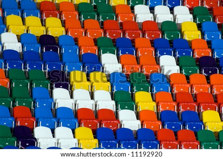 stock-photo-several-rows-of-multi-coloured-plastic-stadium-seats-11192920.jpg