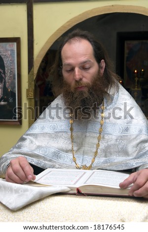 The Russian orthodox priest in a temple