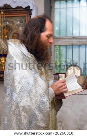 The Russian orthodox priest in a temple