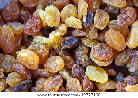 Background made up of raisins. Abstract food textures.