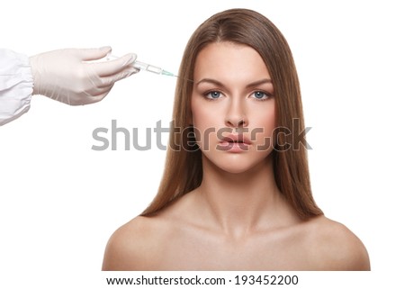 closeup portrait of cosmetic This collagen injection in the female face eyebrow zone