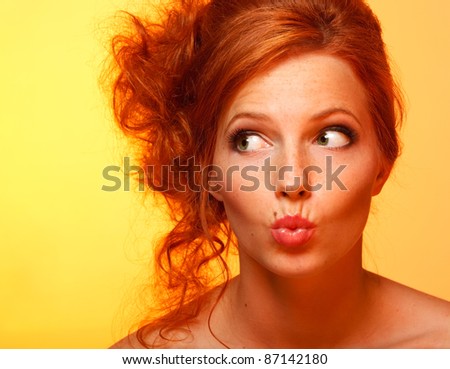 stock photo closeup portrait of lovely redhead girl making funny facial 