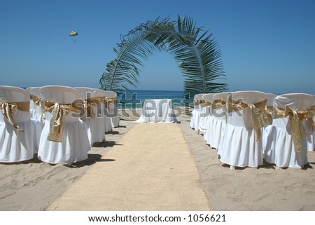 stock photo Mexican beach wedding with chairs alter and aisle