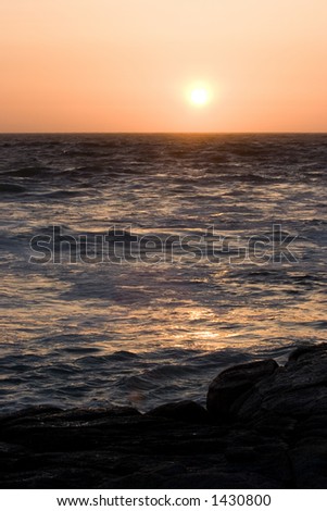 sunset over a rough ocean