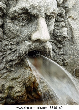 Fountain as a man\'s head pouring water from a mouth