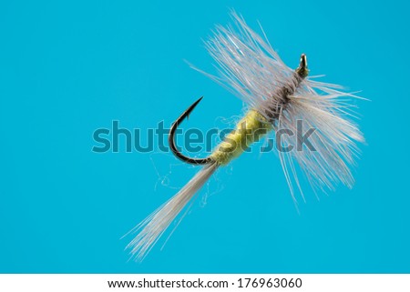 Artificial fishing fly on fishing hook/ Fishing hook / Artificial fishing fly on black fishing hook isolated