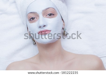 Facial mask for cosmetic treatment/Cosmetic model wearing mask /Facial treatment with cream mask