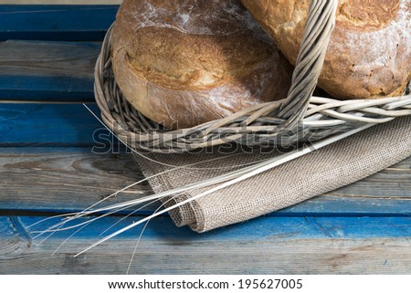 Traditional bread in basket with straws and raw cloth/ Traditional bread / Fresh traditional breads in big basket
