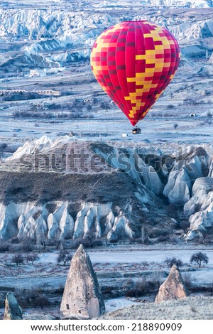 Hot air balloon in Kapadokya/Cappadocia hot air baloon over Cavusin/Hot air baloon over volcanic landscape