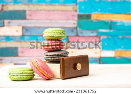 Macarons presentation on colorful background / French macarons cookies display / French desserts with macarons presentation