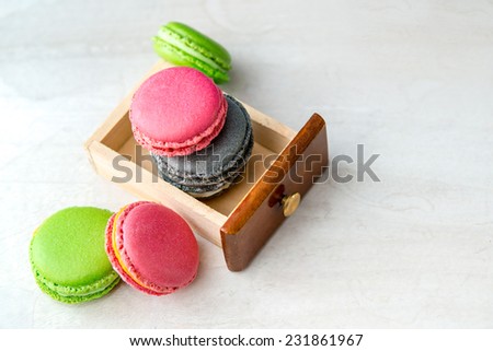 Macarons presentation on a table / French macarons cookies dessert / French dessert with colorful macarons presentation