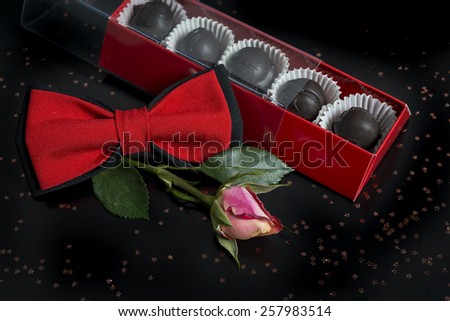 Box of chocolate and roses / Gift box of chocolate bonbons / Gift box with chocolate candy and flowers isolated