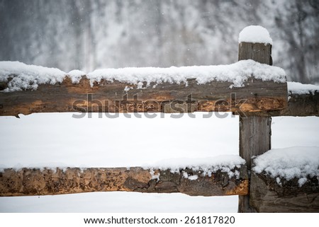 Snowing on a wooden fence / Wooden fence with snow / Snowing on a wooden fence winter landscape