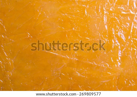 Orange reflective foil texture/ Orange plastic reflective abstract background texture / Orange abstract background texture