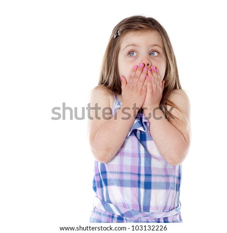 Young girl with hands over mouth on white