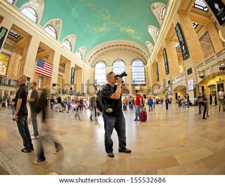 NEW YORK CITY - SEPTEMBER 22: Famous New York City landmark Grand Central Station (has more than 44 tracks and 67 platforms) full of tourists and commuters on September 22, 2013 in New York, NY