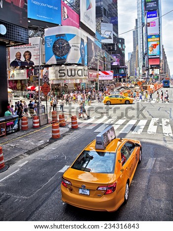 New York City, NY - June 28, 2014: Famous Times Square Theater District and taxi cabs in New York City, NY on June 28, 2014.