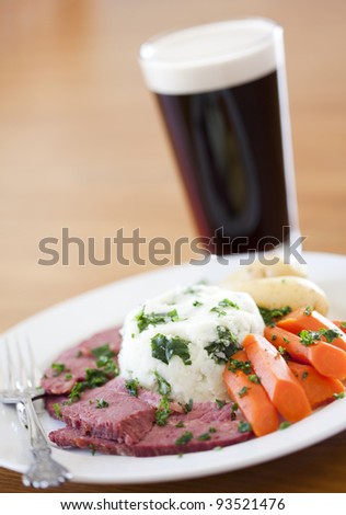 Traditional Corned Beef Dinner with Beer on a table
