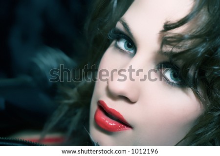 Girl with very beautiful evening make-up. The photo in natural evening colors and tonalities
